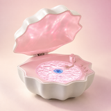 Shell Wave speaker with pink interior, studio product visualization