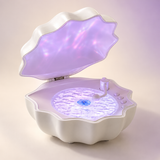 Shell Wave speaker with purple interior, studio product visualization